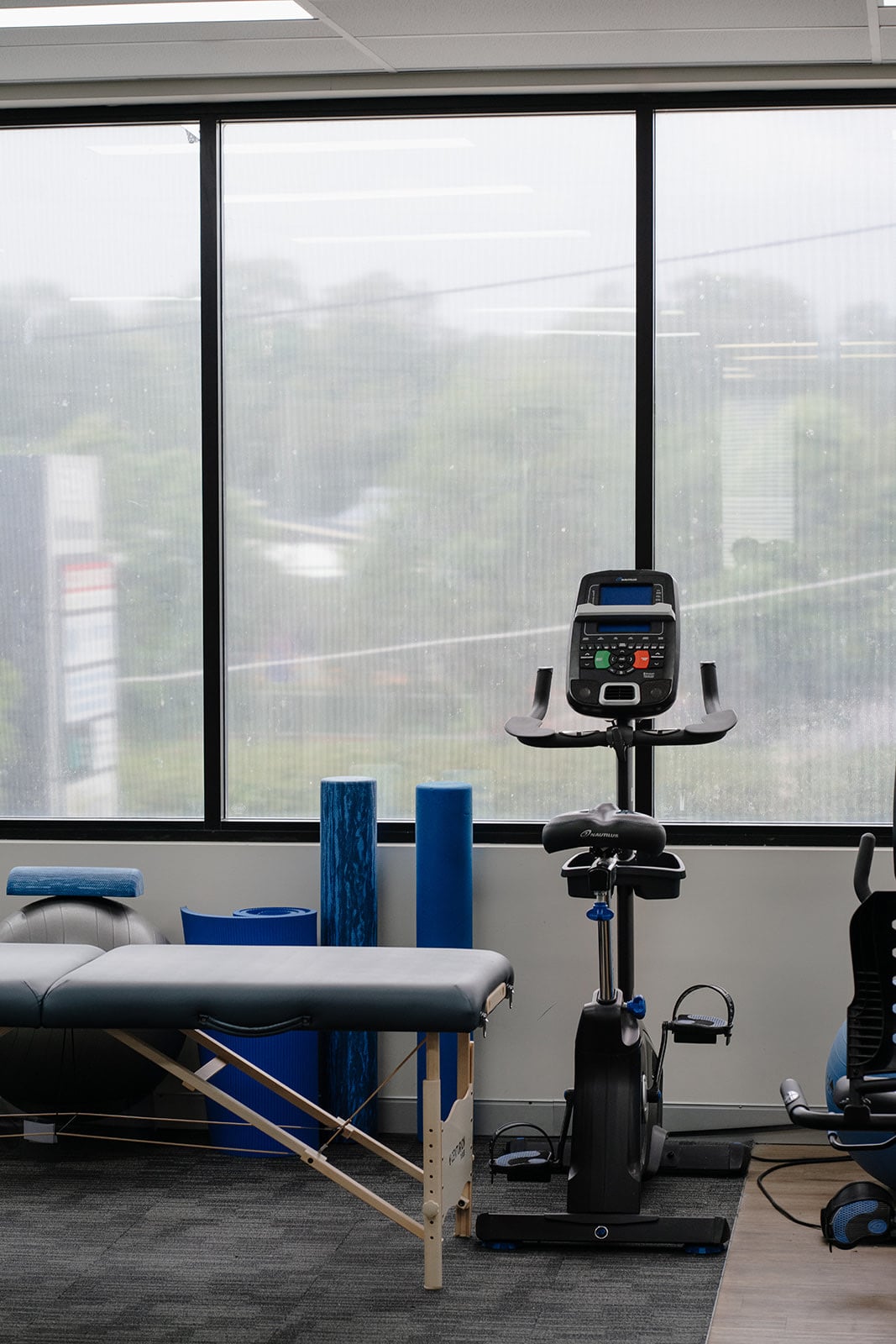 The exercise bike by the gym window