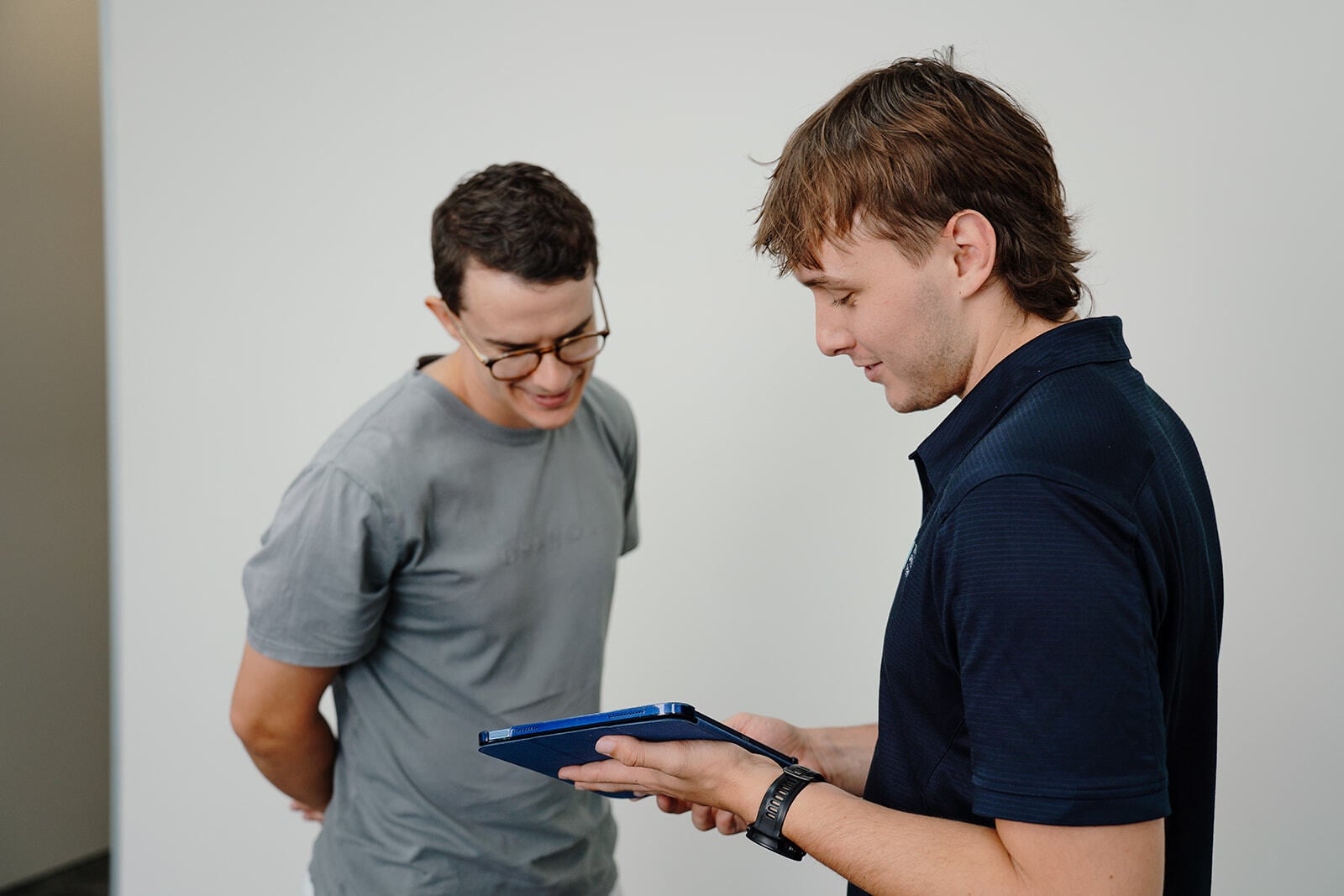 Jarred showing a patient something on a tablet