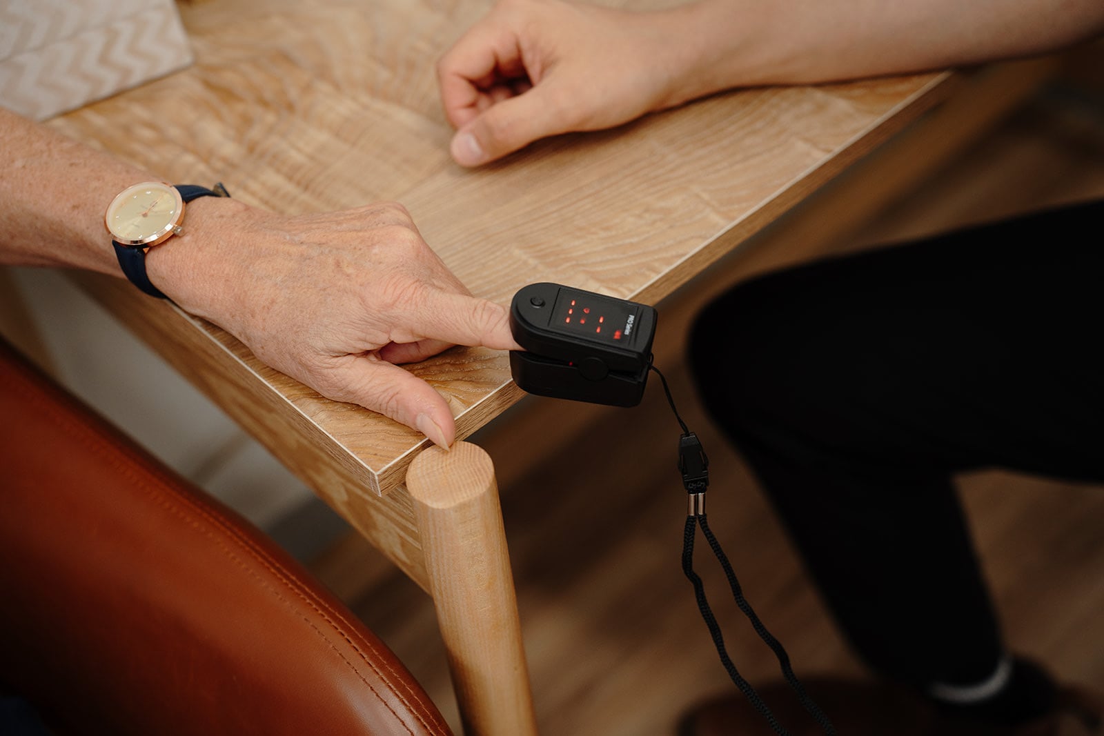 A pulse oximeter on a patient's finger