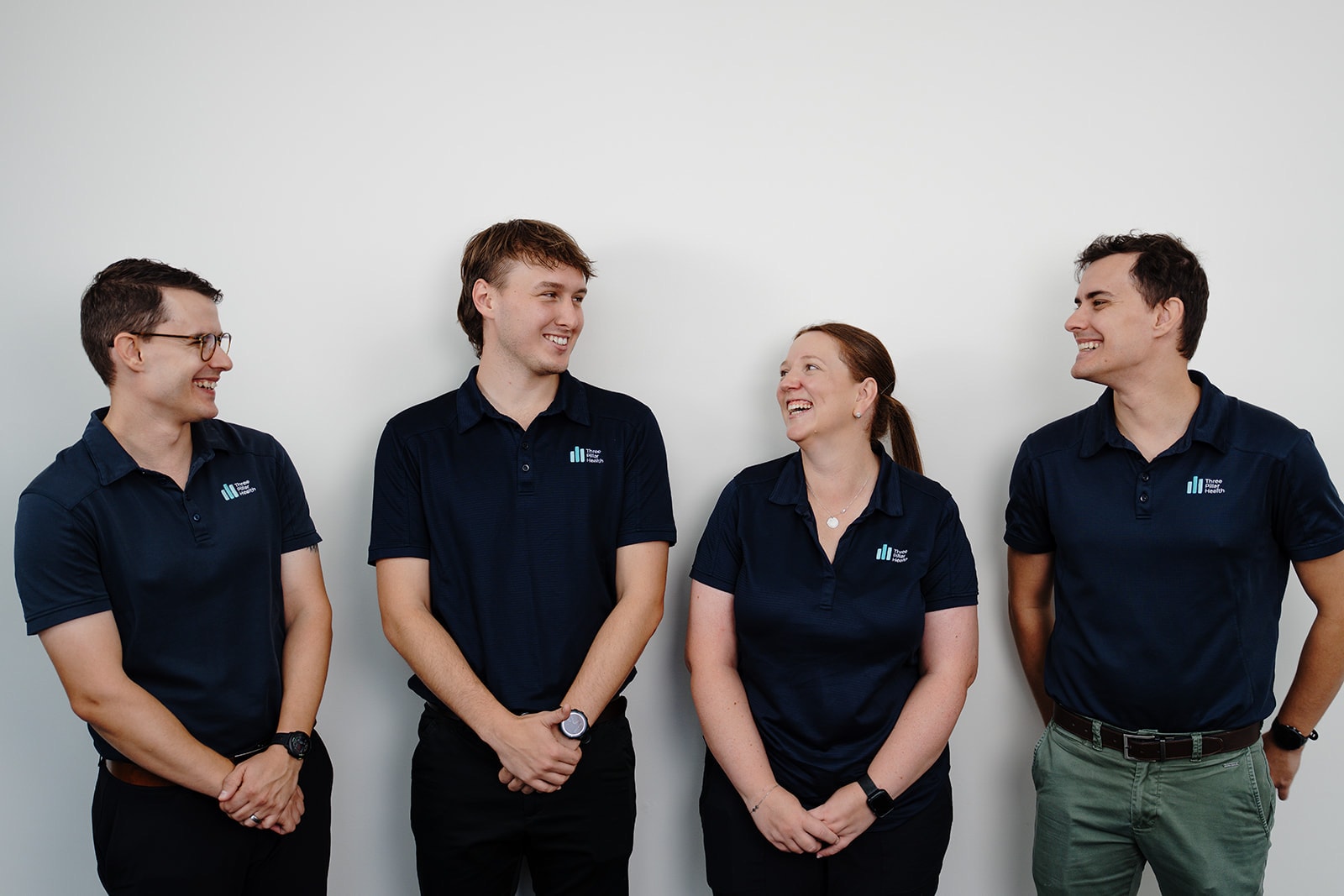 Zac, Jarred, Kylie and Jonathon laughing together at the clinic